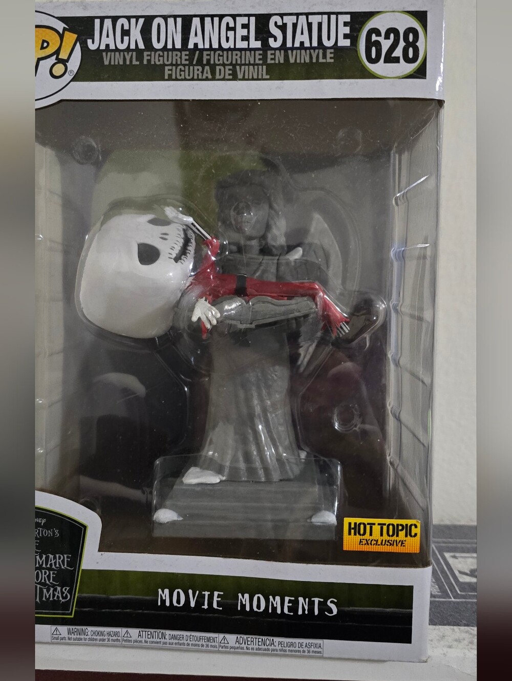 Funko Jack Skellington in Red Outfit with Gray Angel Statue